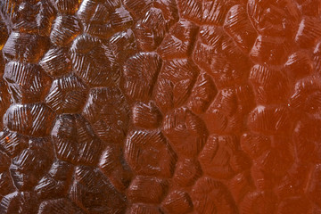 Background - texture of corrugated glass in brown tones. brown corrugated glass with a gradient from light to dark tone.