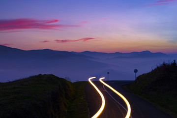 Car Light Trails on mountain road at night © poliki