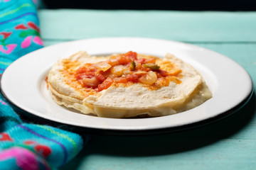 Mexican quesadilla with corn tortilla and piquant sauce also called 