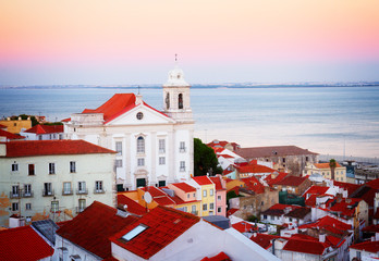 Fototapeta premium view of Alfama at sunset, Lisbon, Portugal