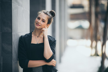 Portrait of a successful business woman smiling. Beautiful young female executive in an urban setting