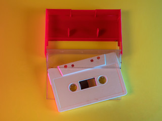 Audio cassette tape vintage analog recording medium from 1970's on yellow background