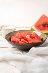 Watermelon fruit cutted in bowl on white background