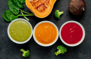 Set of vegetable soups. Broccoli, spinach, green peas soup. Pumpkin and carrot soup. Beetroot and...