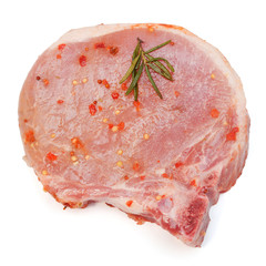 Fresh beef (pork) meat loin with seasonings and pepper isolated on a white background. Perfectly retouched, full depth of field on the photo. Top view, flat lay