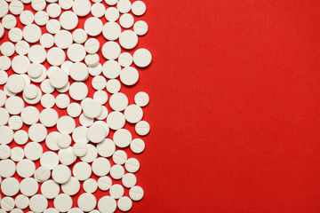 Flat lay top overhead closeup photo of small little pills with parted half place with copy empty blank space for text