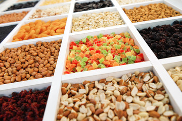 Sweet marmalade cubes lie in a square cell. In neighboring cells, fill in nuts, peanuts, pistachios.