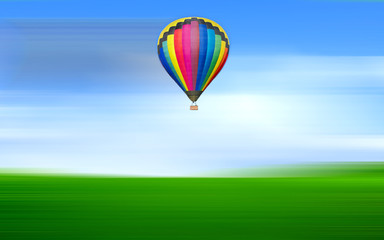 Hot air balloon floating in the blue sky with motion blur