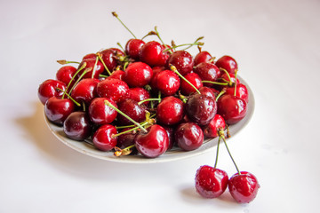 Obraz na płótnie Canvas cherry berries close up macro in white