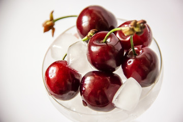 cherries in a glass bowl with ice