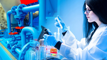 Girl will check the danger of the enterprise. Researcher analyzes emissions. Concept - the...