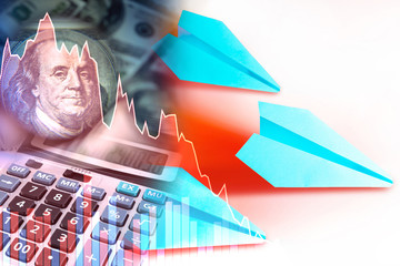 A declining chart as a symbol of crisis. Concept - a falling market. Fallen plane next to the...