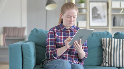 The Young Woman Using Tablet Computer for Internet