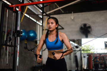 Fototapeta na wymiar Asian woman in fitness gym