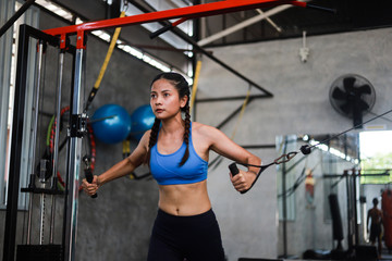 Fototapeta na wymiar Asian woman in fitness gym
