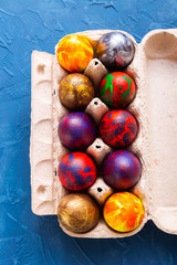 Handmade painted Easter eggs in egg box