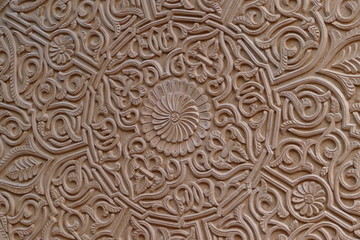 Close-up of beautiful crafted carving / ornaments on a wooden flat table; Morocco, Africa