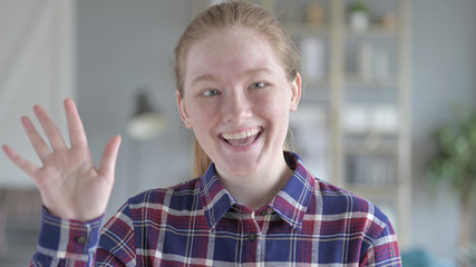 The Young Woman Waving At the Camera
