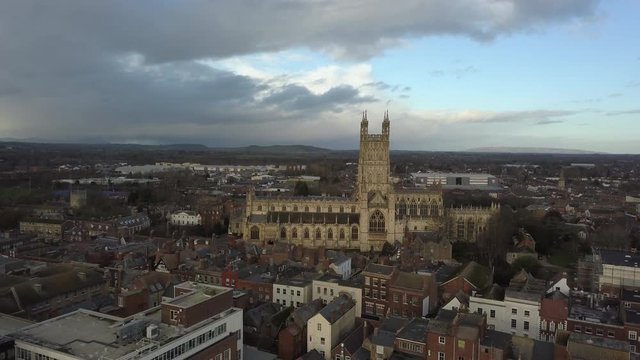 Aerial footage of Gloucester Cathedral on a cloudy day.