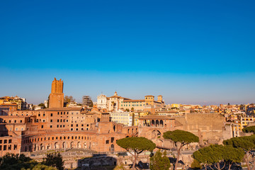 Panorama Rome Italy, sunset city Colosseum ruins Roman Forum from square of Venice