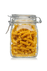 Pasta in a glass jar isolated on white background.