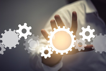 engineer draws a chain sprockets. Technology and industry concept