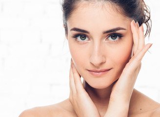 Fototapeta premium Beautiful woman face beauty eyel and smile healthy skin brunette hair casual make up