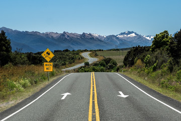 The Milford Road (State Highway 94) making its way through the Southern Alps on New Zealand’s...
