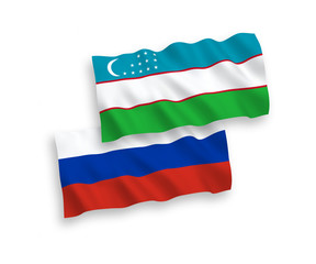 Flags of Uzbekistan and Russia on a white background