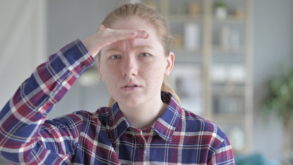 The Close Up of Young Woman Looking for Something