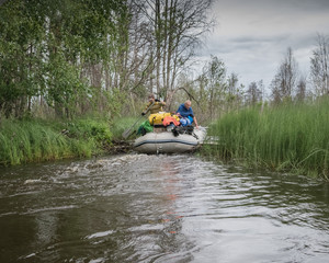Rafting along a wild narrow river in Karelia. Active extreme holidays in Karelia. Ecotourism, visiting fragile, pristine, undisturbed natural areas