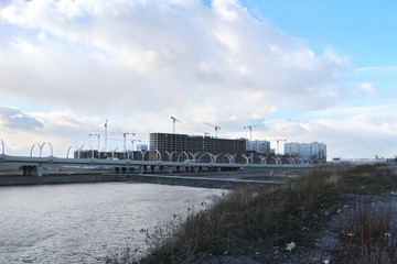 Fototapeta premium Construction of a residential urban quarter by the expressway