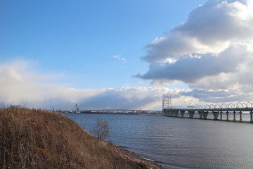 Seascape on a sunny evening with a large bridge
