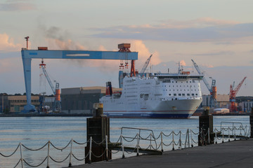 shipyard with cranes and cruise ship at the port of Kiel