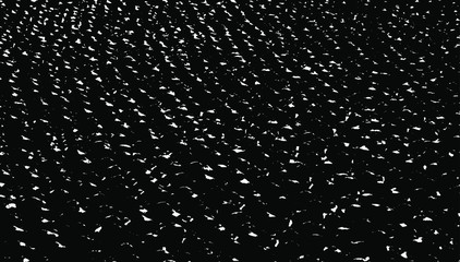 Small uneven spots and particles of debris. Abstract vector texture.  Distressed uneven background. Grunge texture overlay with fine grains isolated on white background. Vector illustration. EPS10.