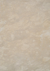 Ecru sandstone on wall closeup