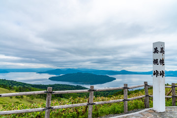 Fototapeta na wymiar Natural landscape of Lake Kussharo in summer season sunny day. Akan Mashu National Park, Hokkaido, Japan. Translation : Bihoro-toge pass lookout