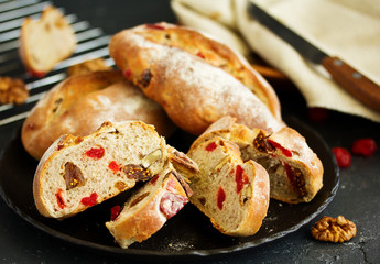Homemade bread with nuts and dried fruits. Selective focus