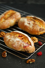 Homemade bread with nuts and dried fruits. Selective focus