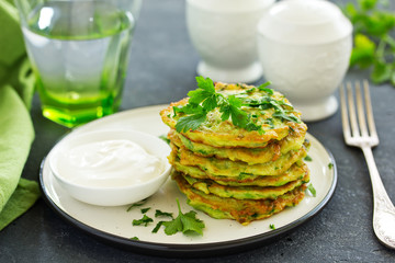 Fritters from zucchini and greens. Selective focus