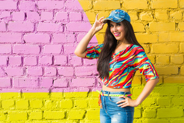 Street dance, freestyle and jazz funk concept - Beautiful girl hip-hop dancer over brick wall with...