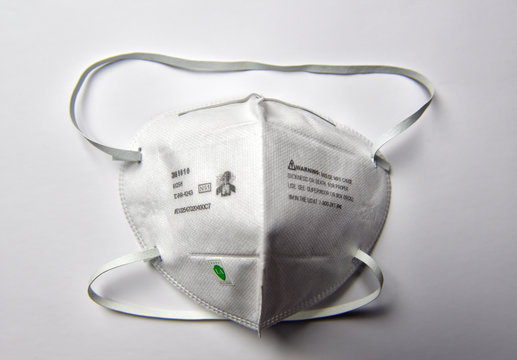 3M Brand N95 Certified Protection Air Filter Mask Lying On White Background.