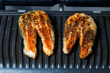 grilled salmon steaks until golden brown with spices and lemon juice