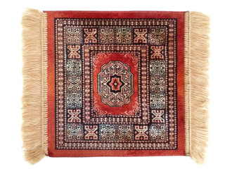 Elegant small red persian rug with fringe isolated on white background.