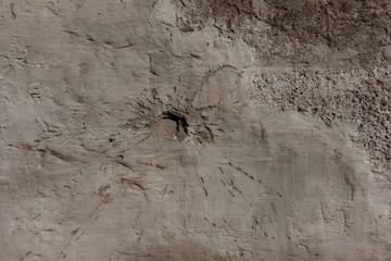 Holes on the wall from shells, bullets.
