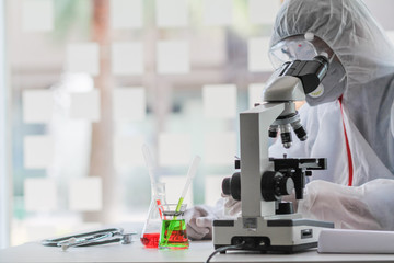 The medical team wore a coronavirus protective suit and rubber gloves to examine the coronavirus covid-19 and research for a vaccine to prevent coronavirus covid-19 to stop the epidemic