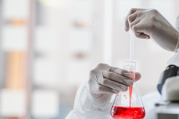 The medical team wore a coronavirus protective suit and rubber gloves to examine the coronavirus covid-19 and research for a vaccine to prevent coronavirus covid-19 to stop the epidemic