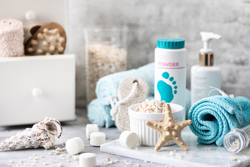 Fototapeta na wymiar Spa accessories - sea salt, brush, powder, effervescent bath tablets, pumice, cream on a light background. 