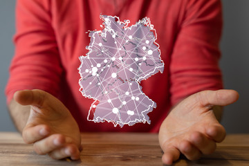 a virtual germany land  map digital in hand 3d