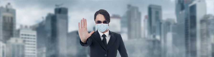 Female Officer showing stop hand sign in corona virus case